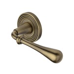 M Marcus Heritage Brass Door Handle Lever Latch on Round Rose Roma Reeded Design